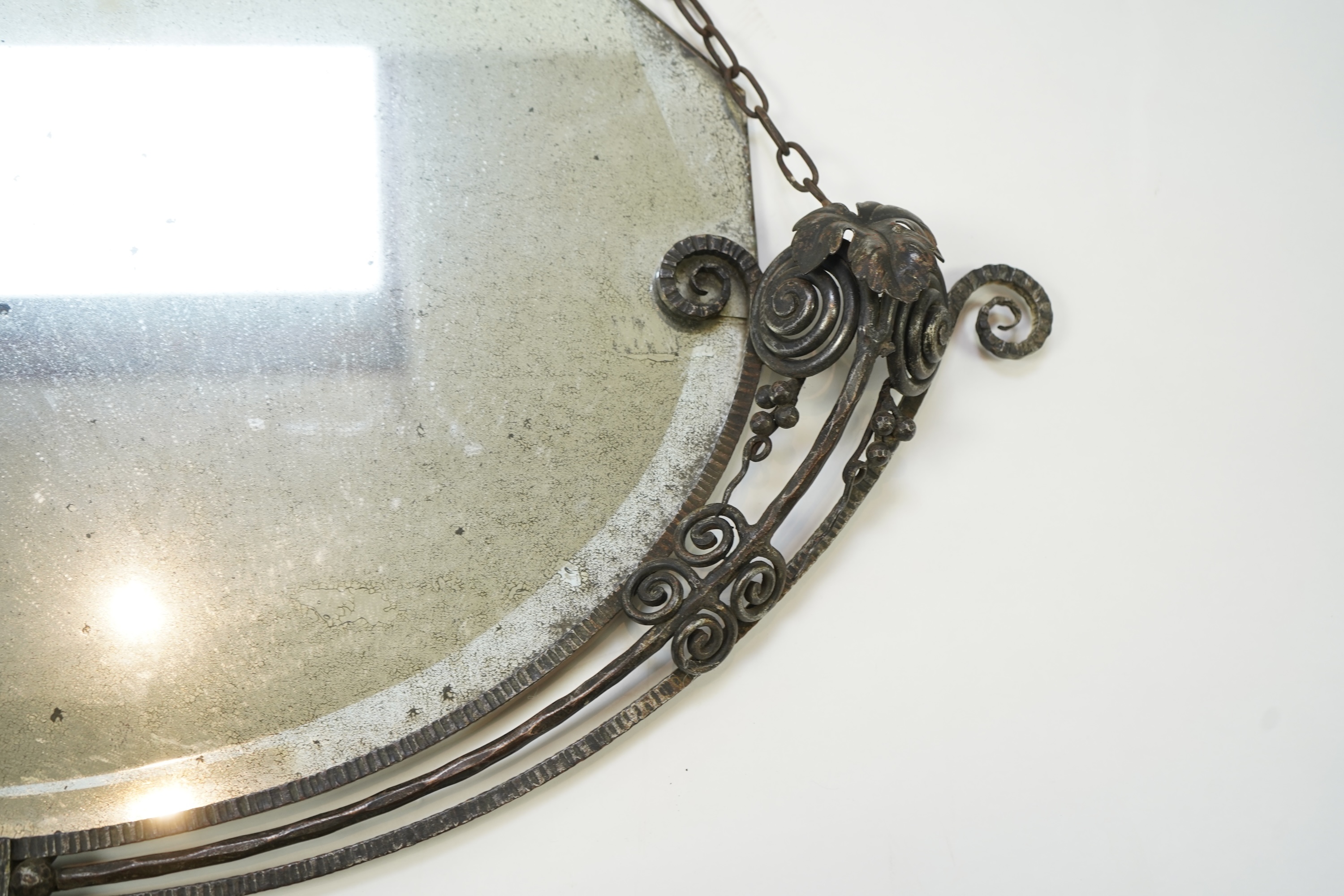 Manner of Edgar Brandt (French, 1880-1960): An Art Deco style wall mirror